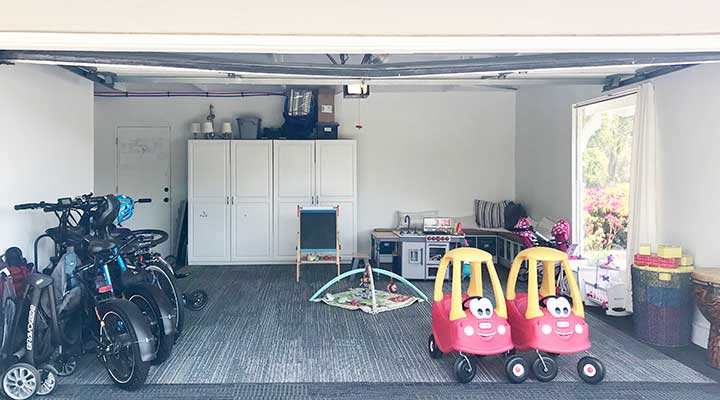 a bike rack is installed on one end of a family garage for optimal garage bike storage